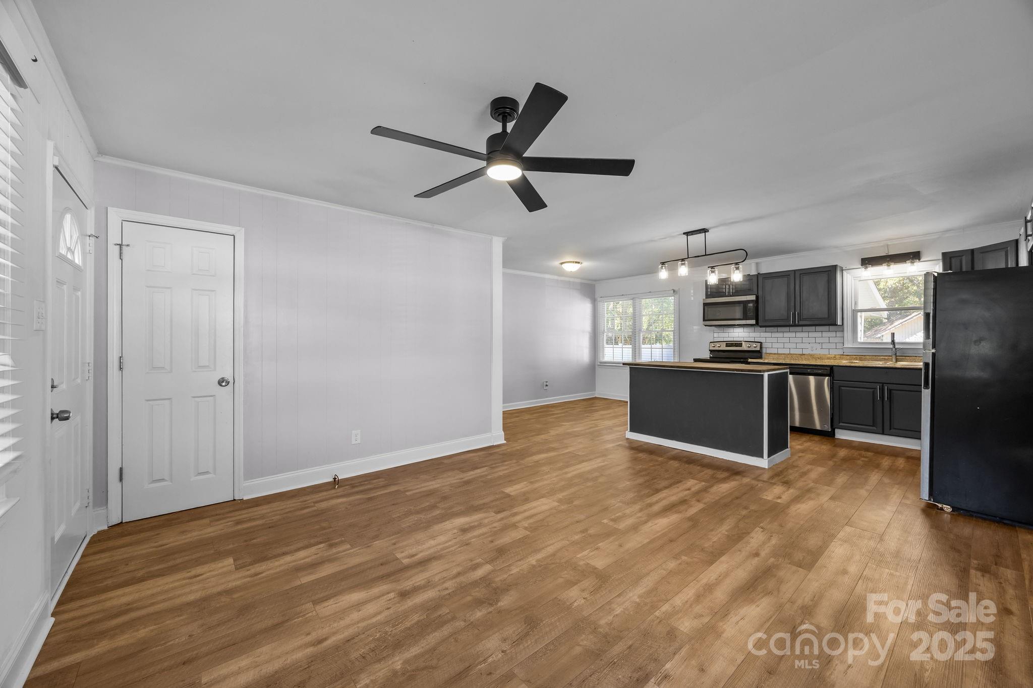 976 10 Oaks Drive Lancaster, SC 29720 - Photo 7 of 24 a view of kitchen with wooden floor and window