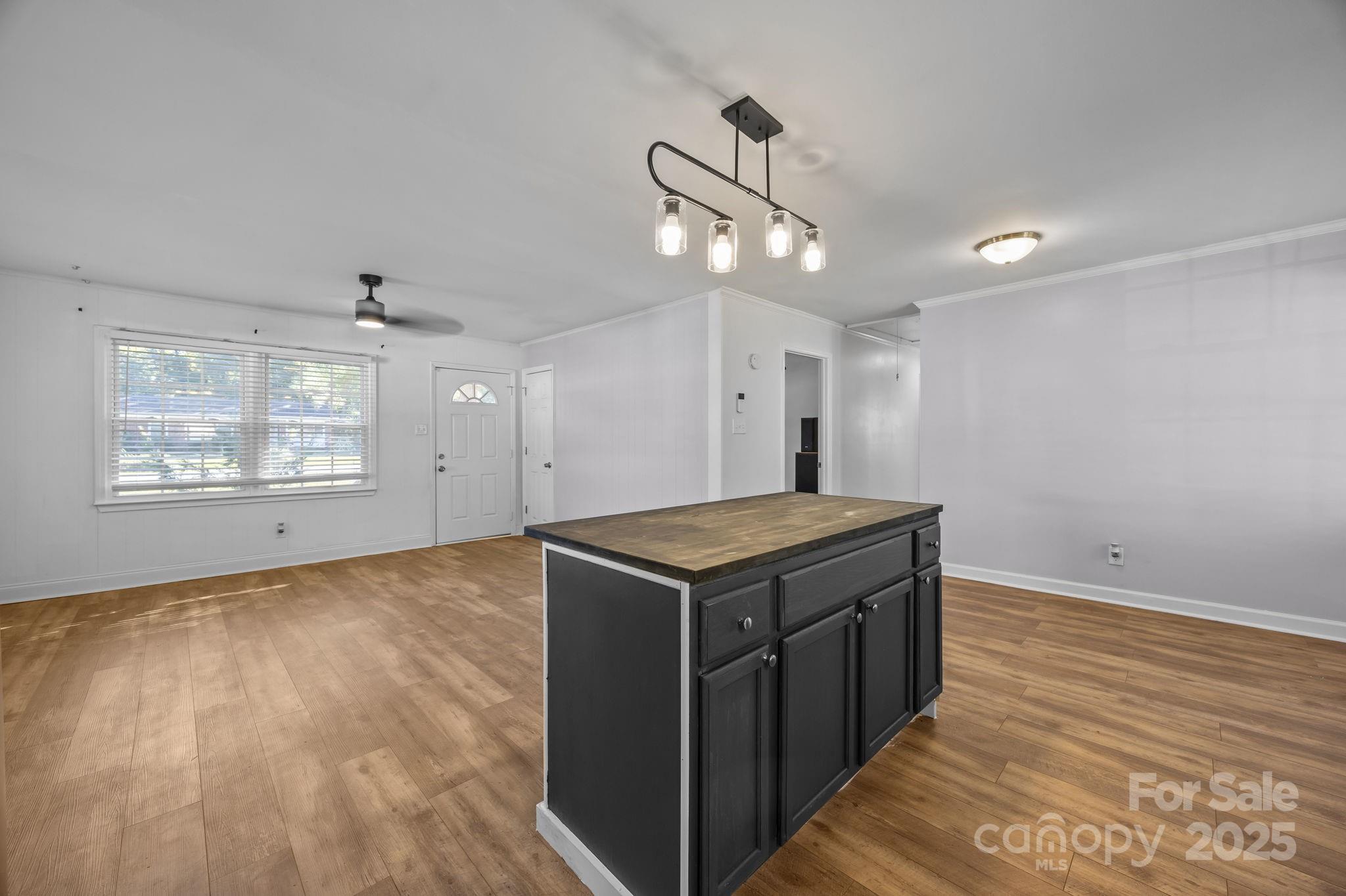 976 10 Oaks Drive Lancaster, SC 29720 - Photo 8 of 24 a kitchen with a stove and a wooden floor