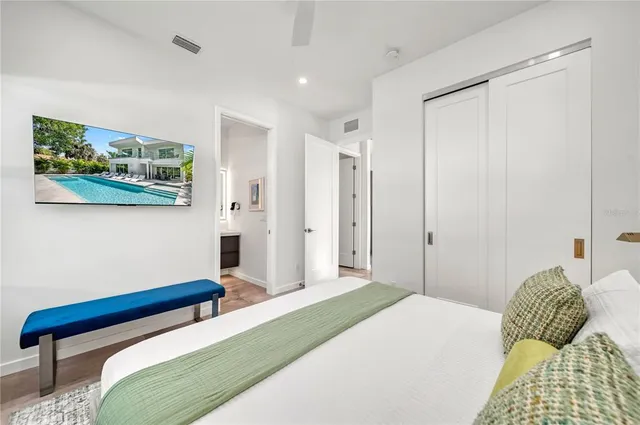 a bedroom with a bed and a dresser