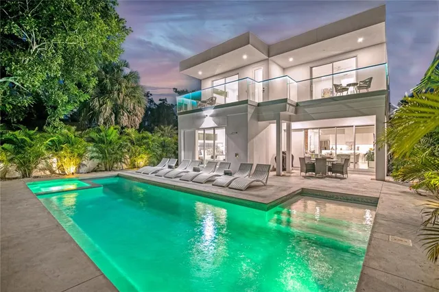 a view of a swimming pool with sitting area