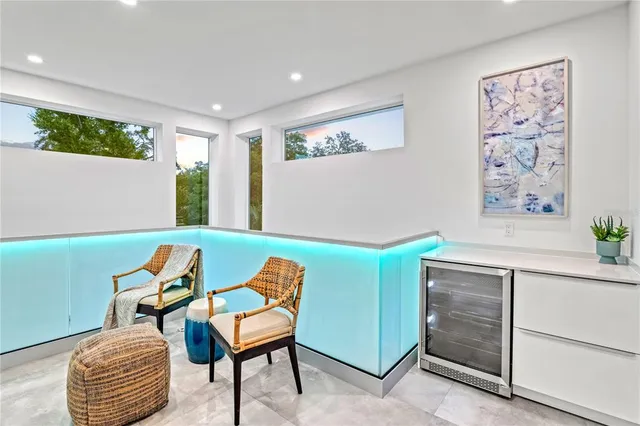 a bedroom with a bed and a chair