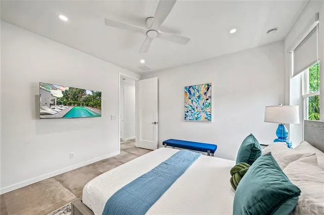 a bedroom with a bed and a table