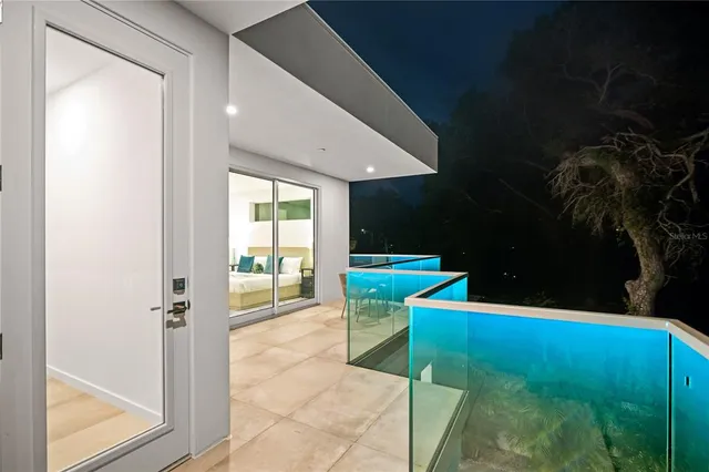 a view of a house with backyard sitting area and garden