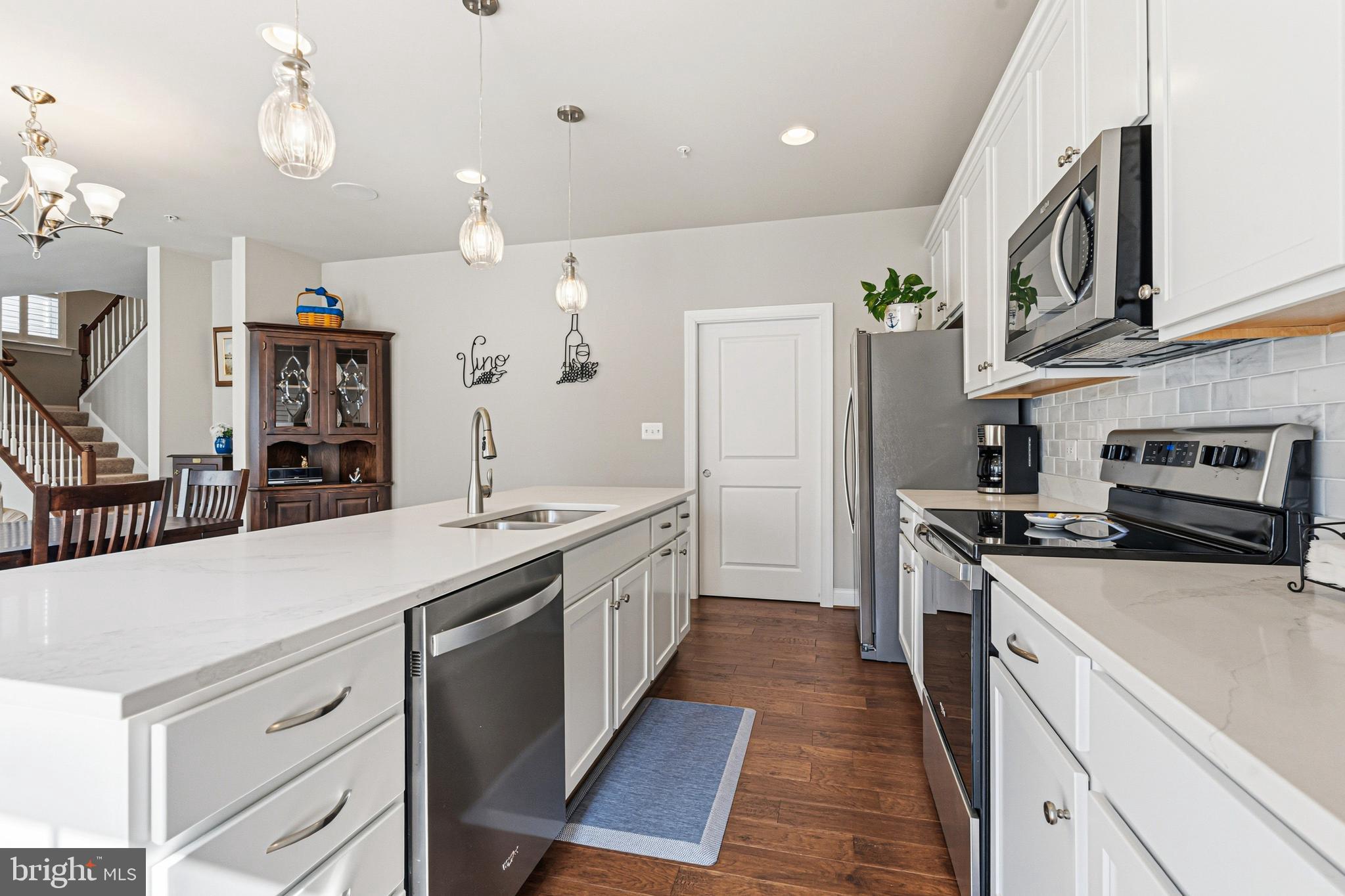 113 Harding Street Lutherville-Timonium, MD 21093 - Photo 12 of 45 a kitchen with stainless steel appliances granite countertop a sink a stove and a refrigerator
