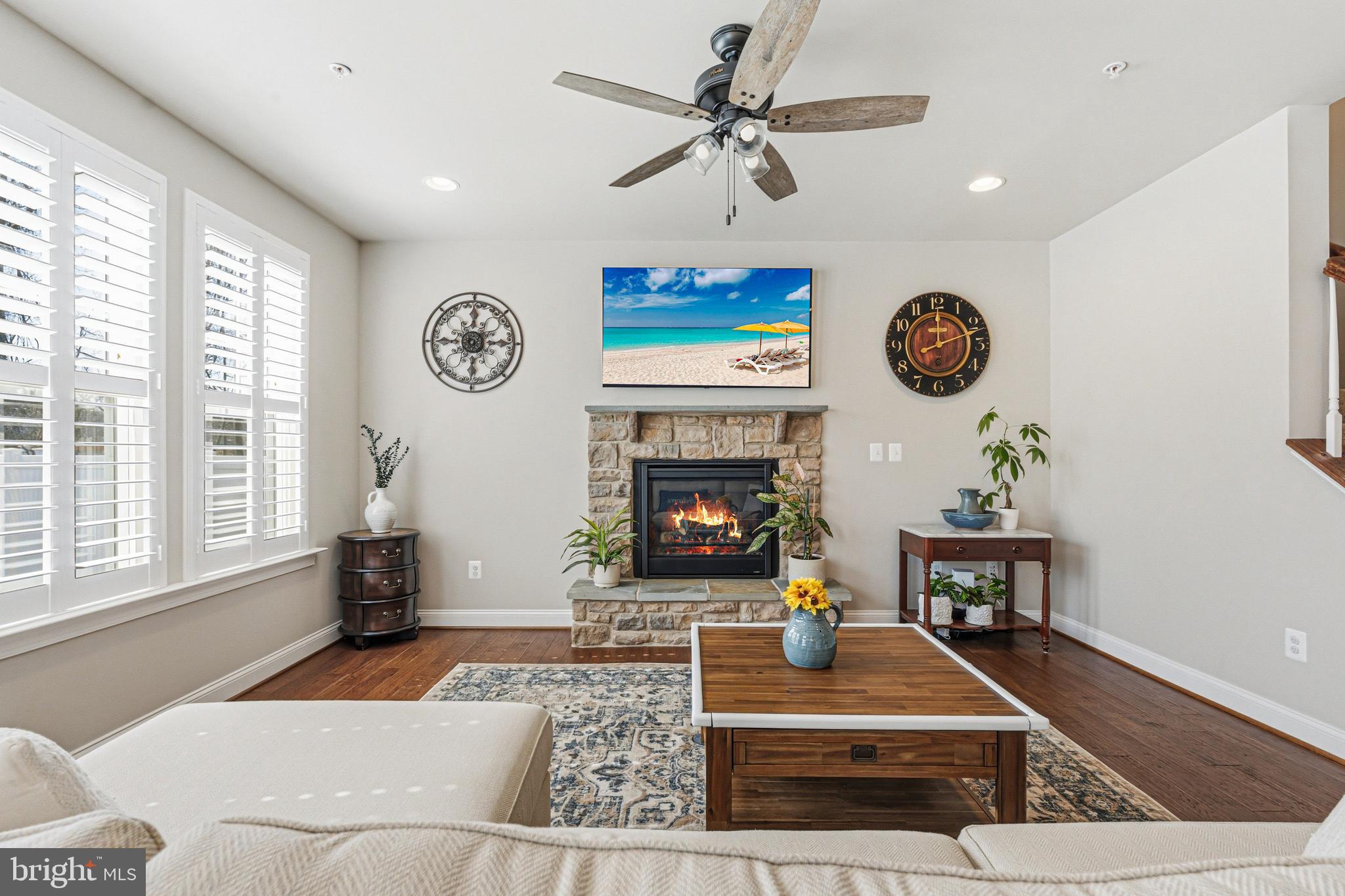 113 Harding Street Lutherville-Timonium, MD 21093 - Photo 15 of 45 a living room with furniture a clock and a fireplace