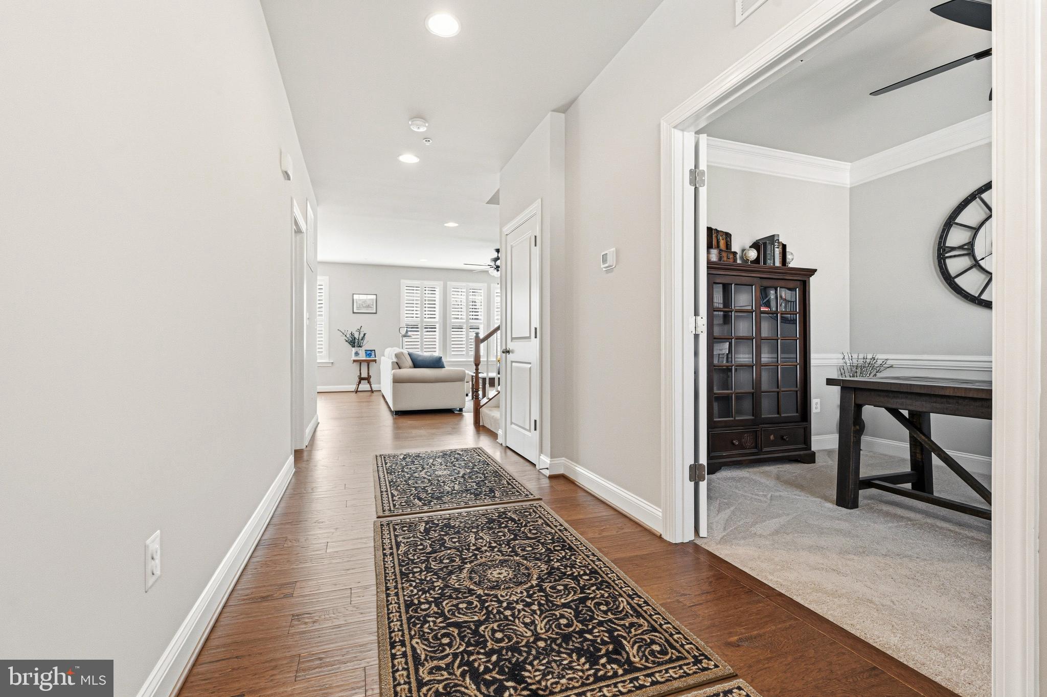 113 Harding Street Lutherville-Timonium, MD 21093 - Photo 19 of 45 a hallway with a large mirror and furniture