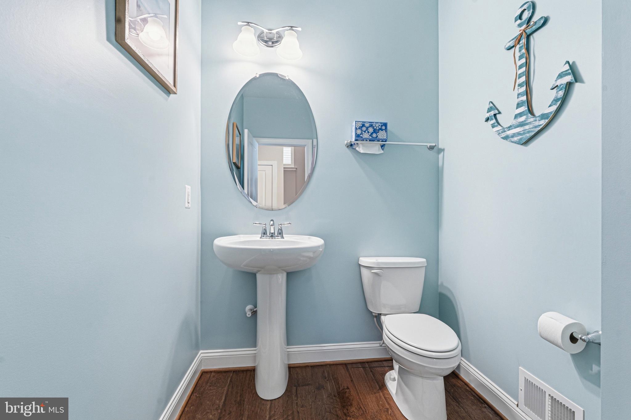 113 Harding Street Lutherville-Timonium, MD 21093 - Photo 21 of 45 a bathroom with a toilet sink and mirror