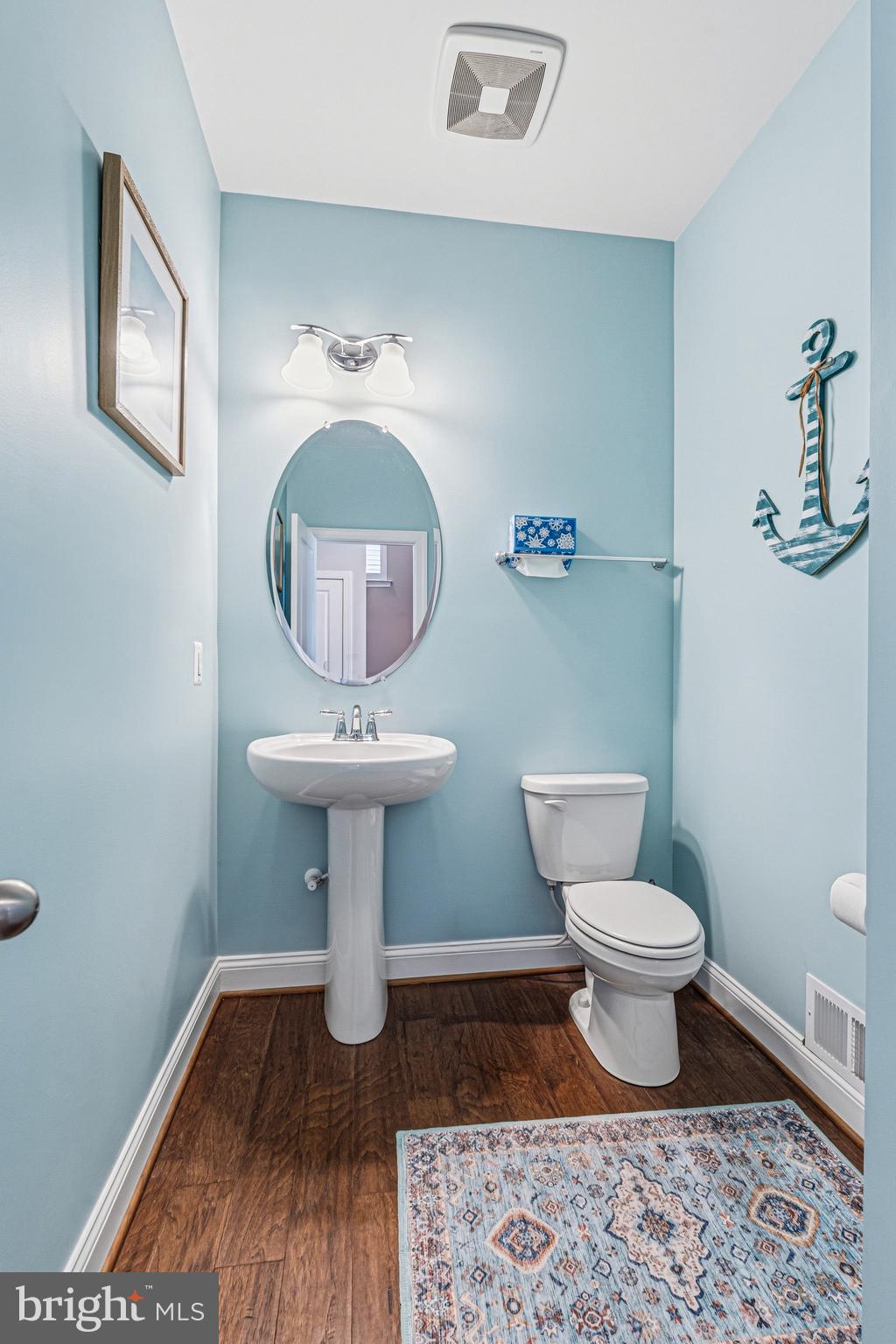 113 Harding Street Lutherville-Timonium, MD 21093 - Photo 22 of 45 a bathroom with a toilet a sink and mirror