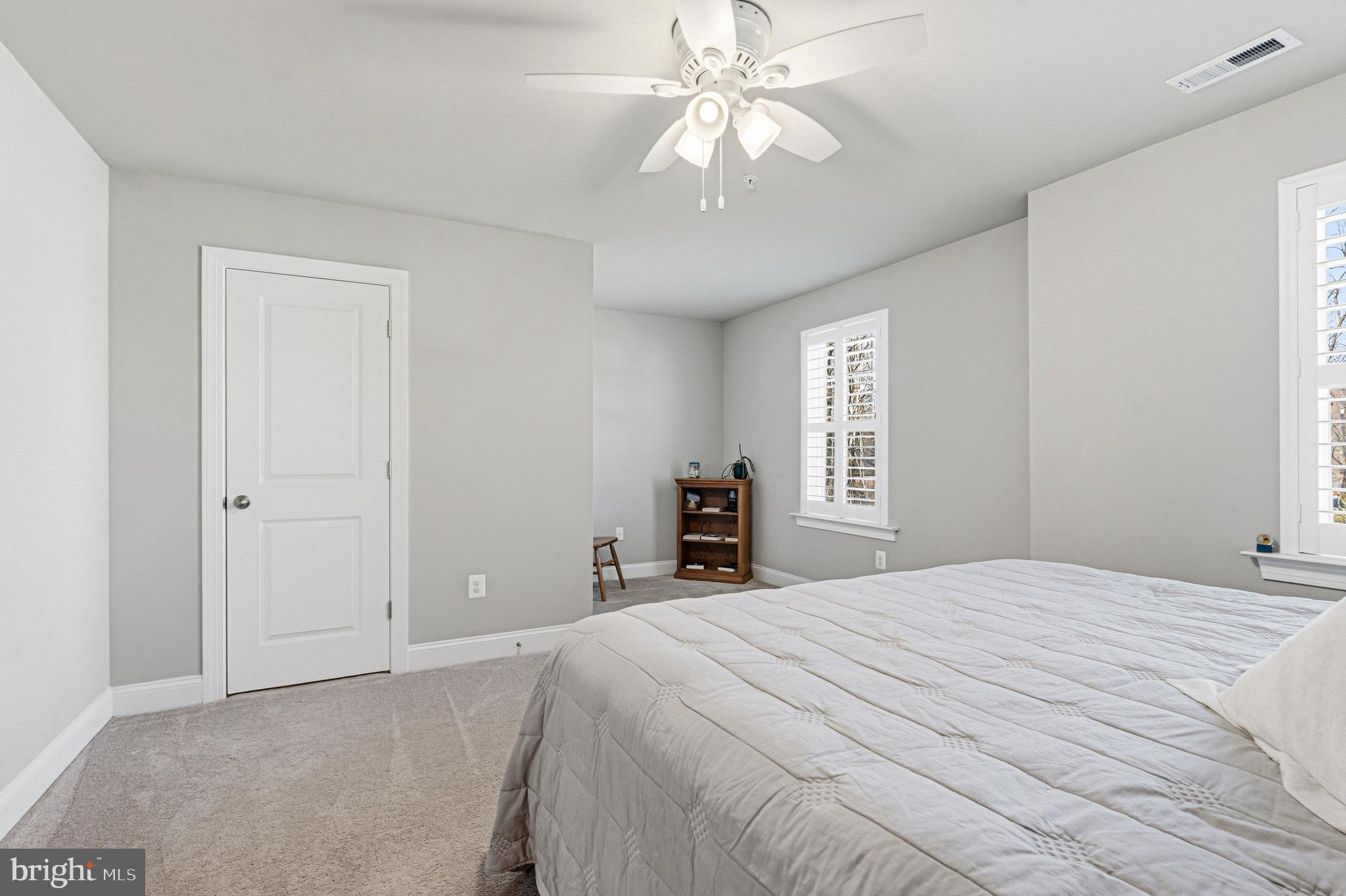 113 Harding Street Lutherville-Timonium, MD 21093 - Photo 31 of 45 a bedroom with a large bed and a chandelier