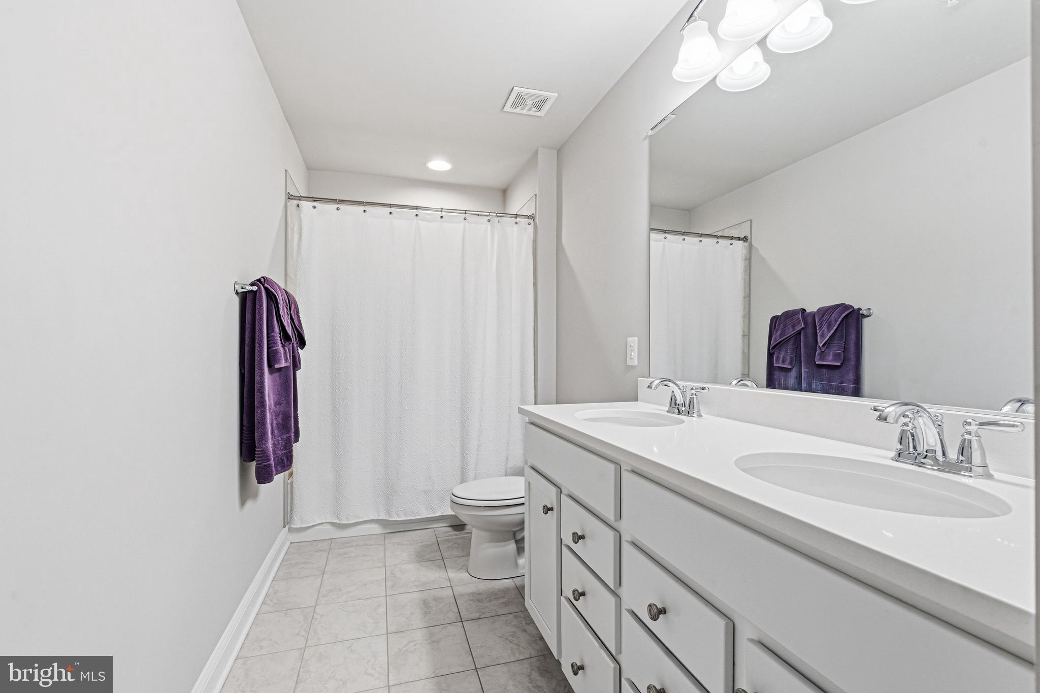 113 Harding Street Lutherville-Timonium, MD 21093 - Photo 34 of 45 a bathroom with a sink a toilet and shower