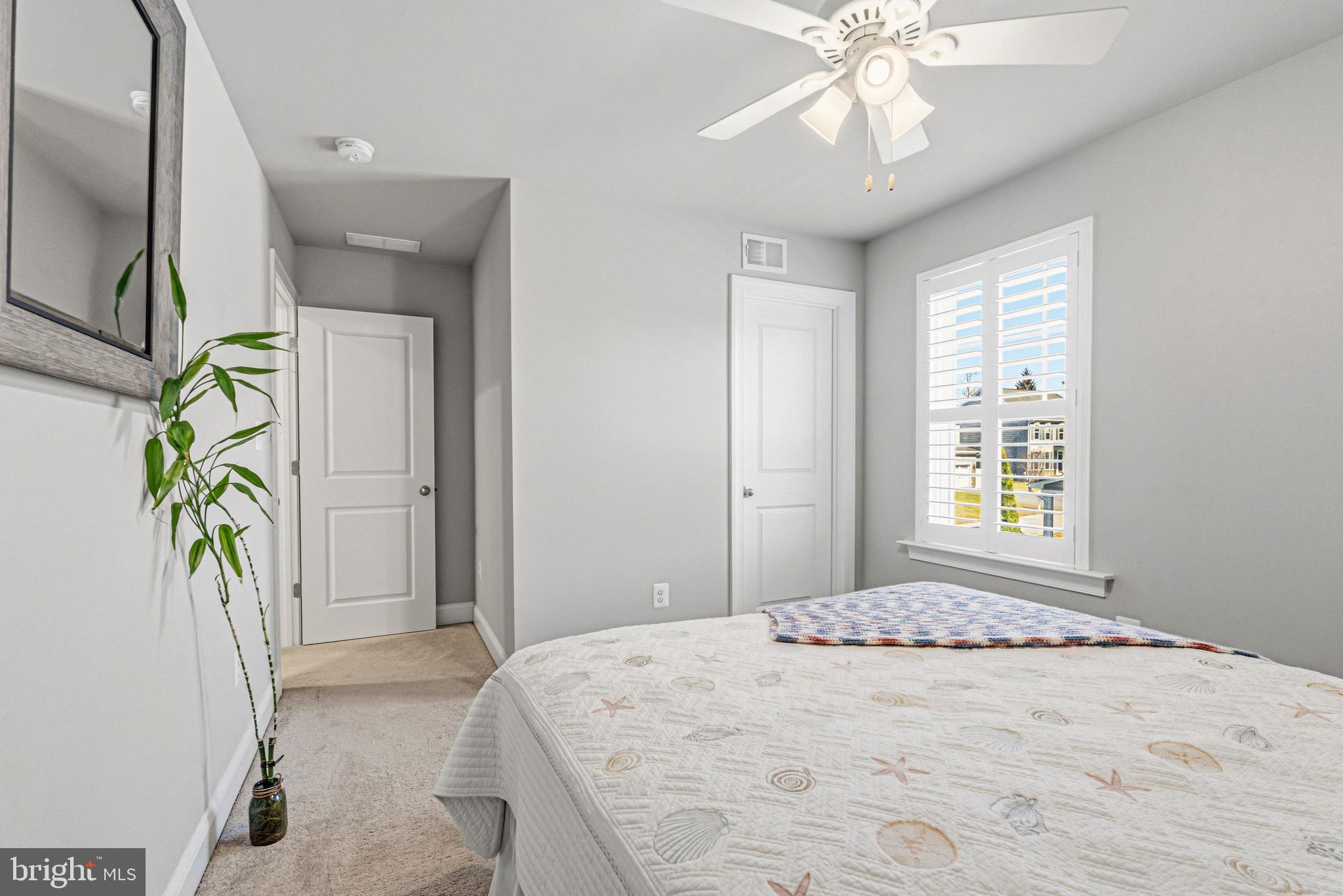 113 Harding Street Lutherville-Timonium, MD 21093 - Photo 36 of 45 a bedroom with a bed and a chandelier