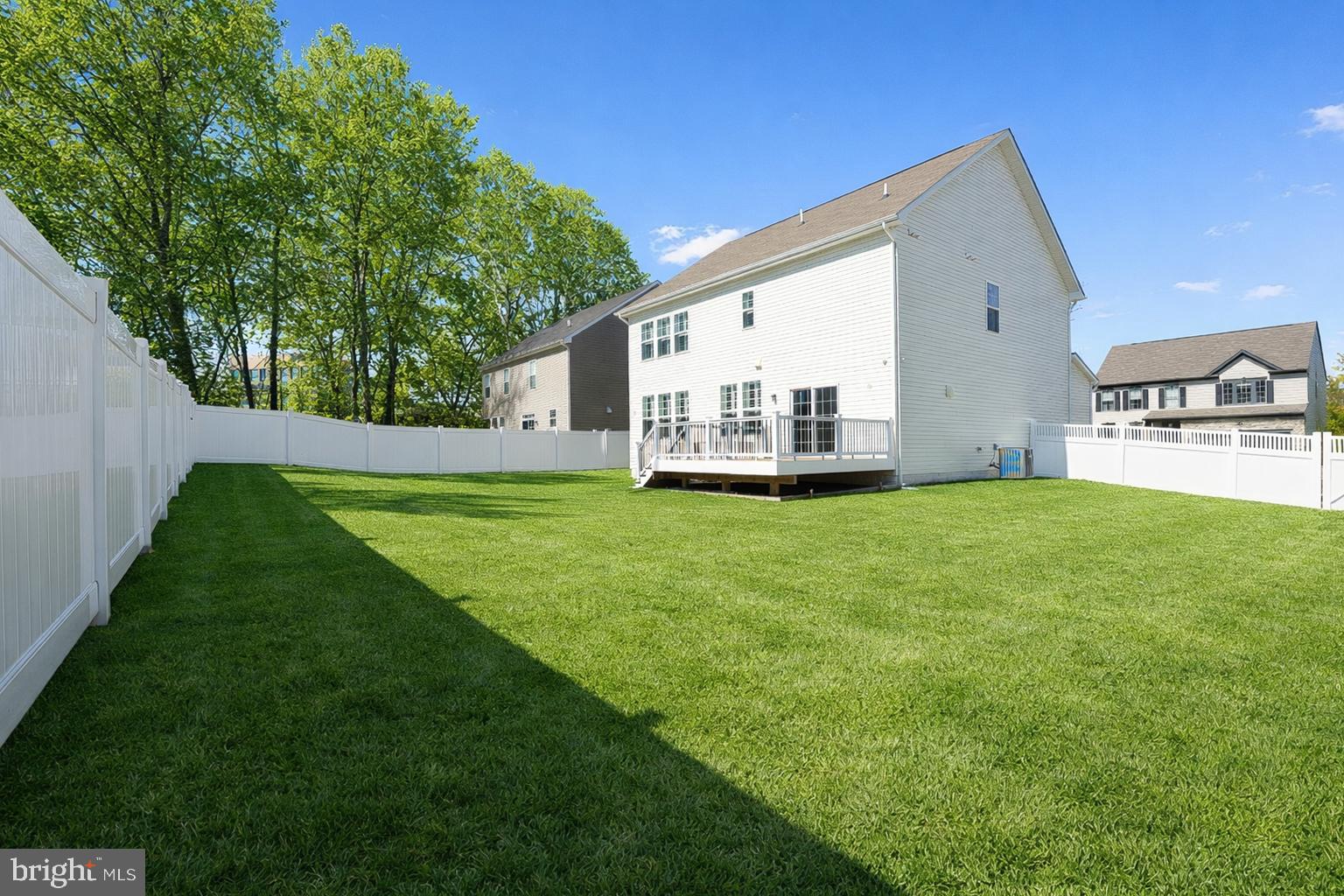 113 Harding Street Lutherville-Timonium, MD 21093 - Photo 5 of 45 a front view of a house with a yard and trees