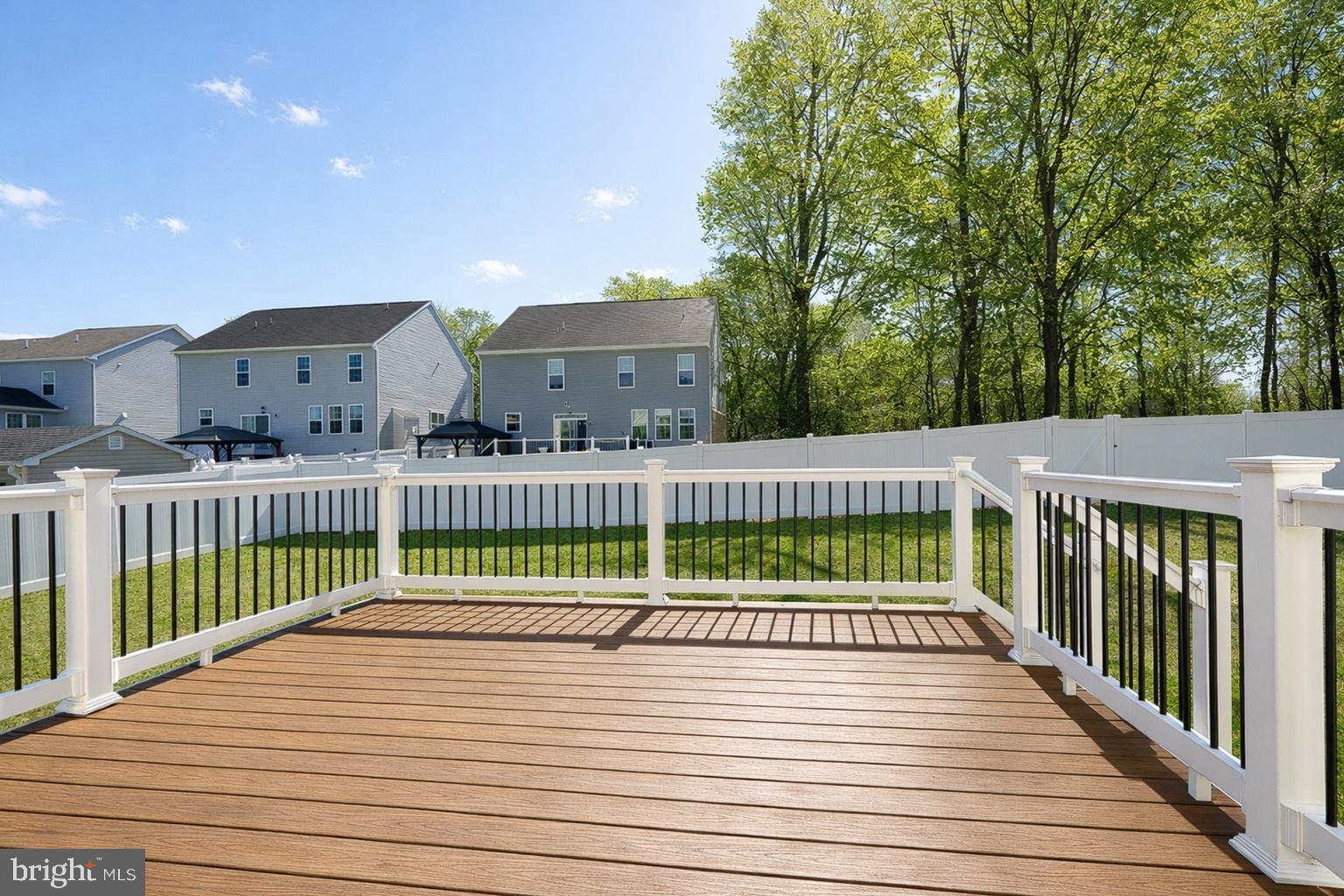 113 Harding Street Lutherville-Timonium, MD 21093 - Photo 7 of 45 a view of a deck with wooden floor and fence