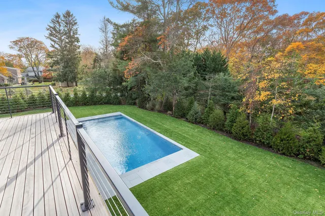 a view of a backyard with a wooden deck