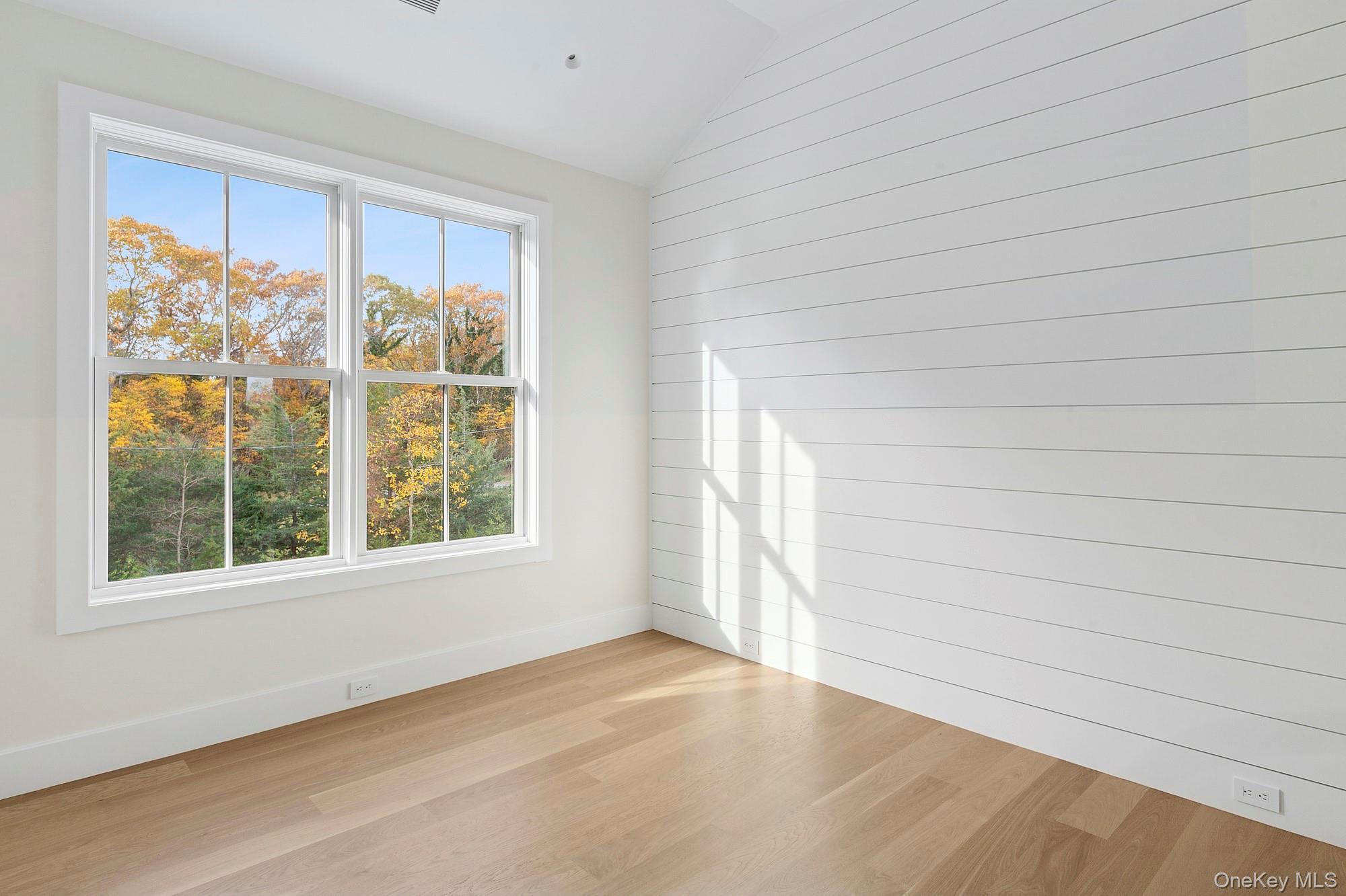 25 Liberty Street Westhampton Beach, NY 11978 - Photo 18 of 33 an empty room with windows
