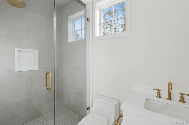 a bathroom with a shower and a sink