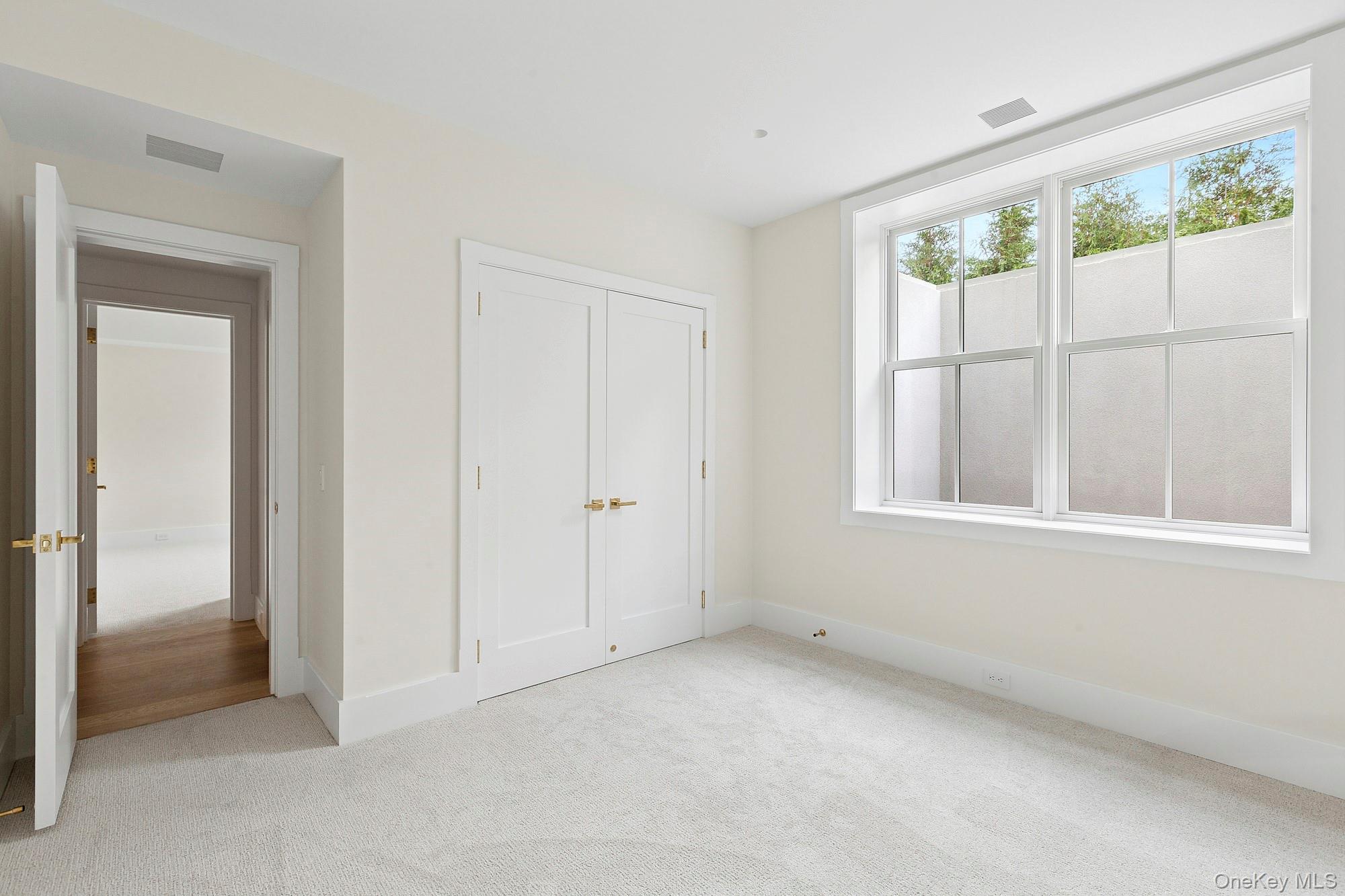 25 Liberty Street Westhampton Beach, NY 11978 - Photo 29 of 33 a view of an empty room with a window