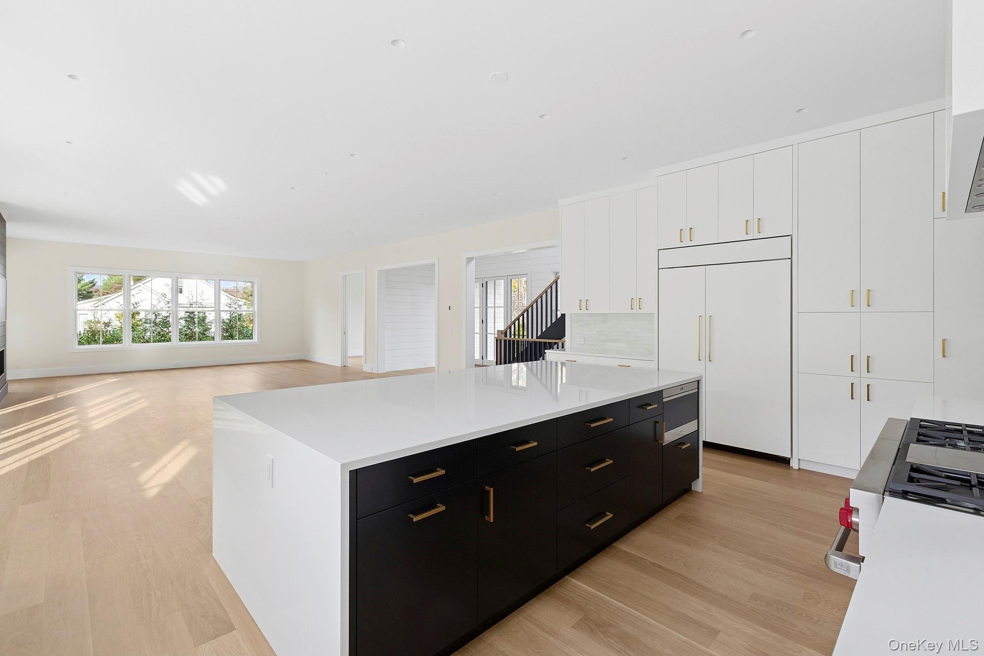 25 Liberty Street Westhampton Beach, NY 11978 - Photo 7 of 33 a kitchen with a cabinets and a sink