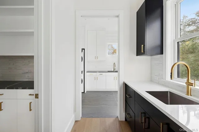 a kitchen with a sink and a refrigerator
