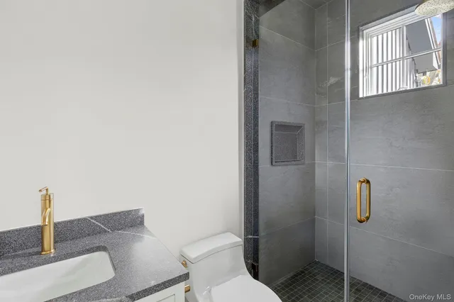 a bathroom with a toilet and shower
