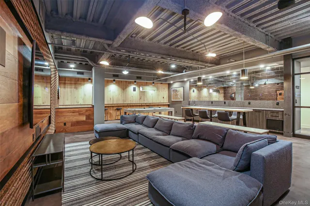 a media room with lots of chairs and a projector screen