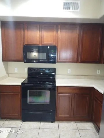 a kitchen with a sink and a microwave