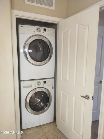 a view of a hallway with washer and dryer