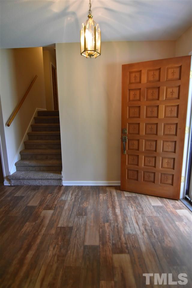 6354 Helena Moriah Road Rougemont, NC 27572 - Photo 13 of 21 a view of an empty room with wooden floor and stairs