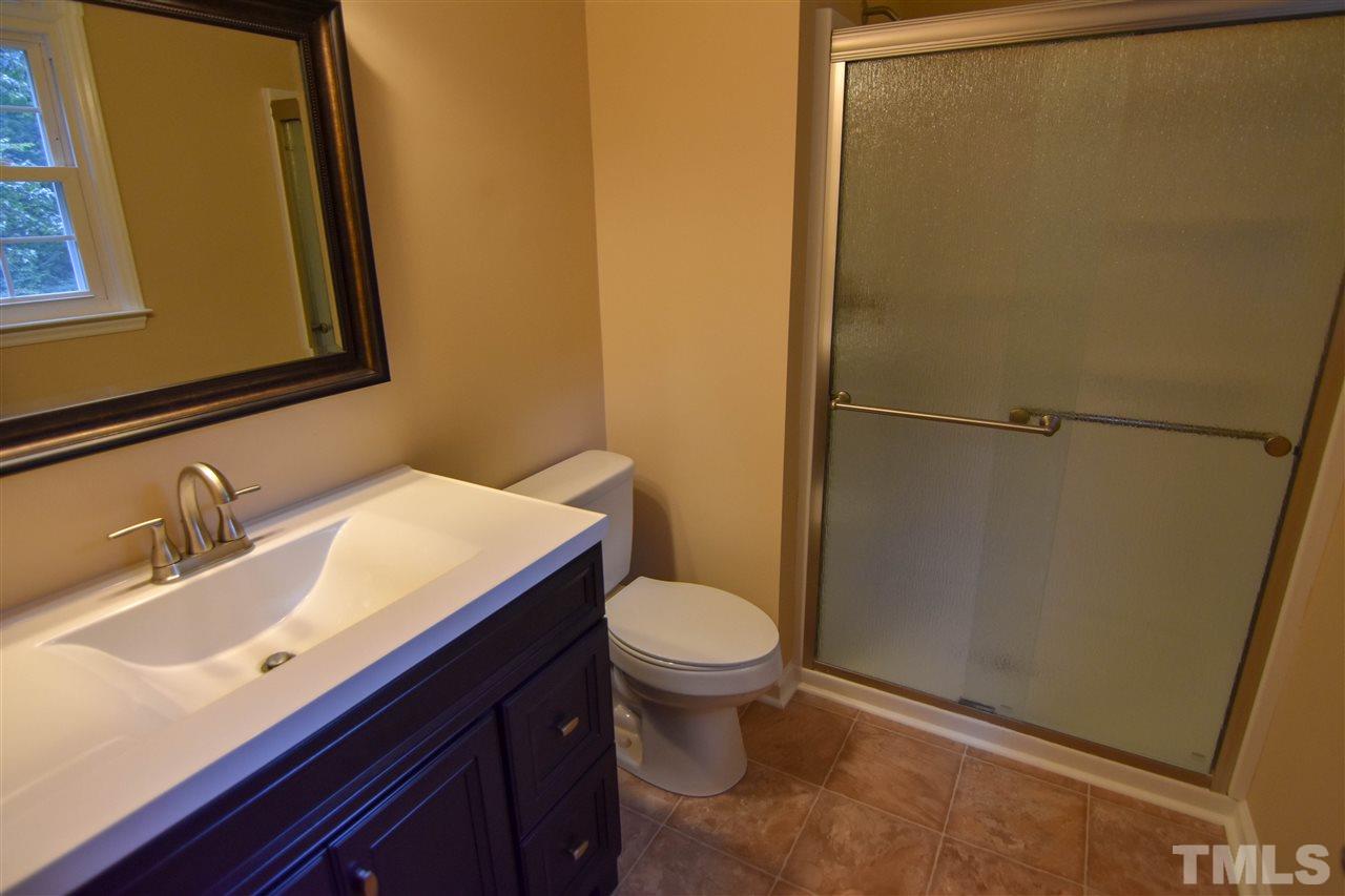 6354 Helena Moriah Road Rougemont, NC 27572 - Photo 16 of 21 a bathroom with a granite countertop sink and a mirror