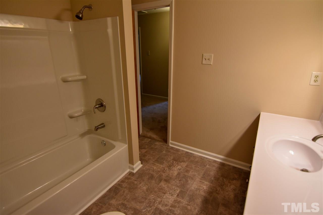 6354 Helena Moriah Road Rougemont, NC 27572 - Photo 18 of 21 a bathroom with a tub and shower