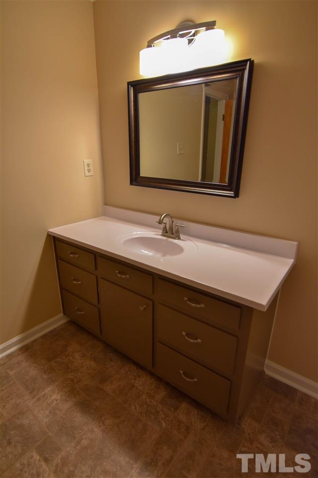 6354 Helena Moriah Road Rougemont, NC 27572 - Photo 19 of 21 a bathroom with a sink and a mirror