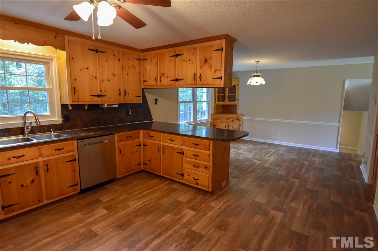 6354 Helena Moriah Road Rougemont, NC 27572 - Photo 7 of 21 a kitchen with stainless steel appliances granite countertop a sink and cabinets