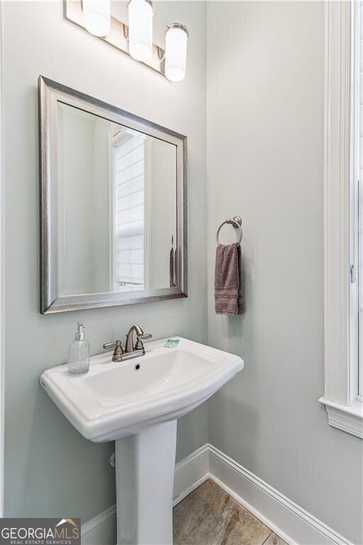 172 Turtle Track Lane, Unit OCEAN Jekyll Island, GA 31527 - Photo 13 of 51 a bathroom with a sink and a mirror