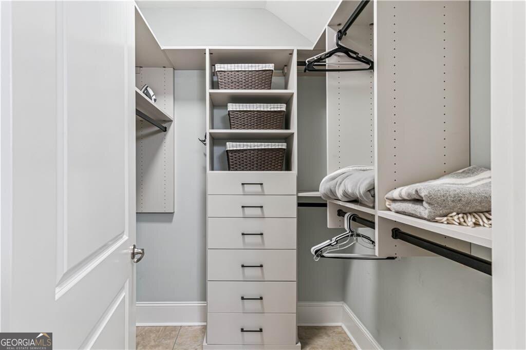 172 Turtle Track Lane, Unit OCEAN Jekyll Island, GA 31527 - Photo 18 of 51 a view of walk in closet with clothes and shoes