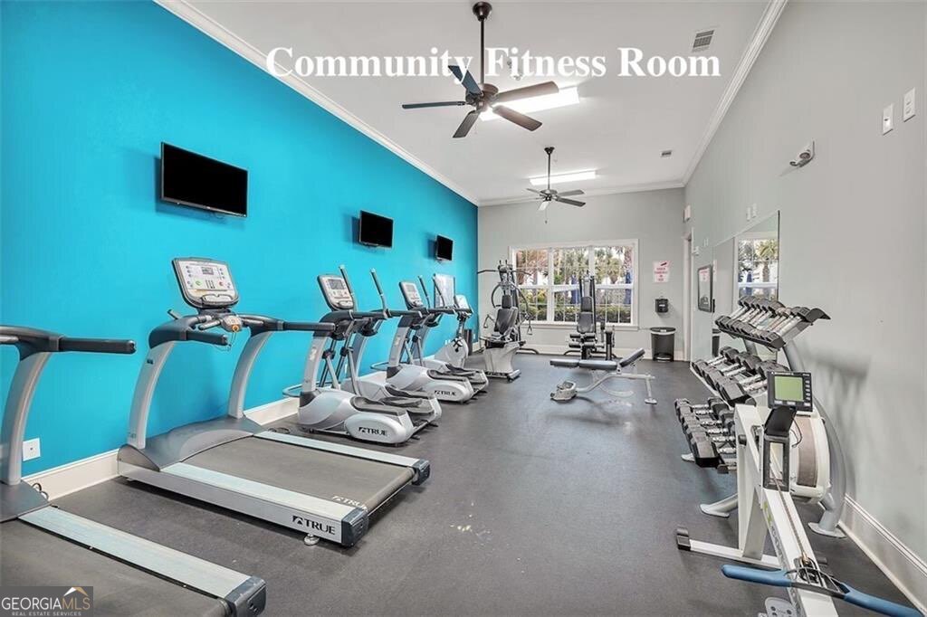 172 Turtle Track Lane, Unit OCEAN Jekyll Island, GA 31527 - Photo 45 of 51 a room with gym equipment and a large window