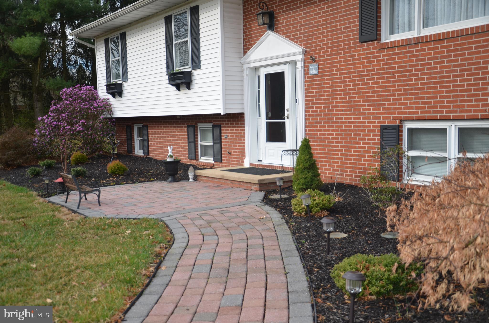 19704 Trunk Road White Hall, MD 21161 - Photo 3 of 59 The brick sidewalk stretches from the driveway