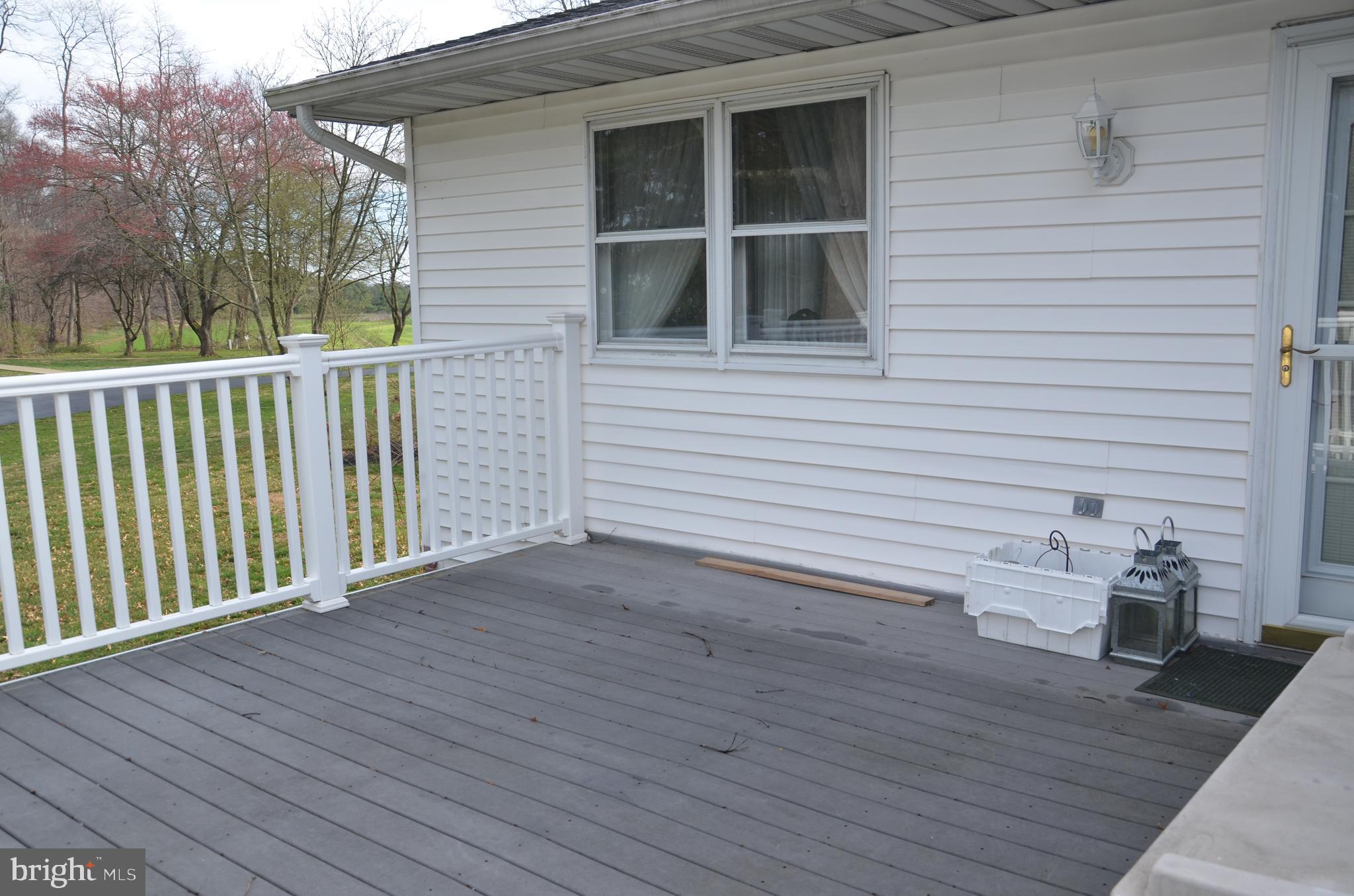 19704 Trunk Road White Hall, MD 21161 - Photo 42 of 59 The upper deck has vinyl railings and trex decking
