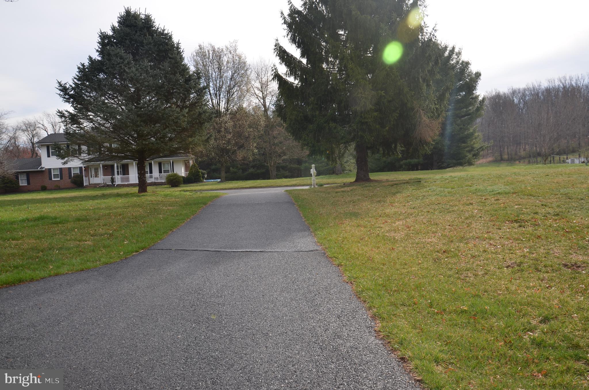 19704 Trunk Road White Hall, MD 21161 - Photo 57 of 59 Long asphalt driveway with good parking