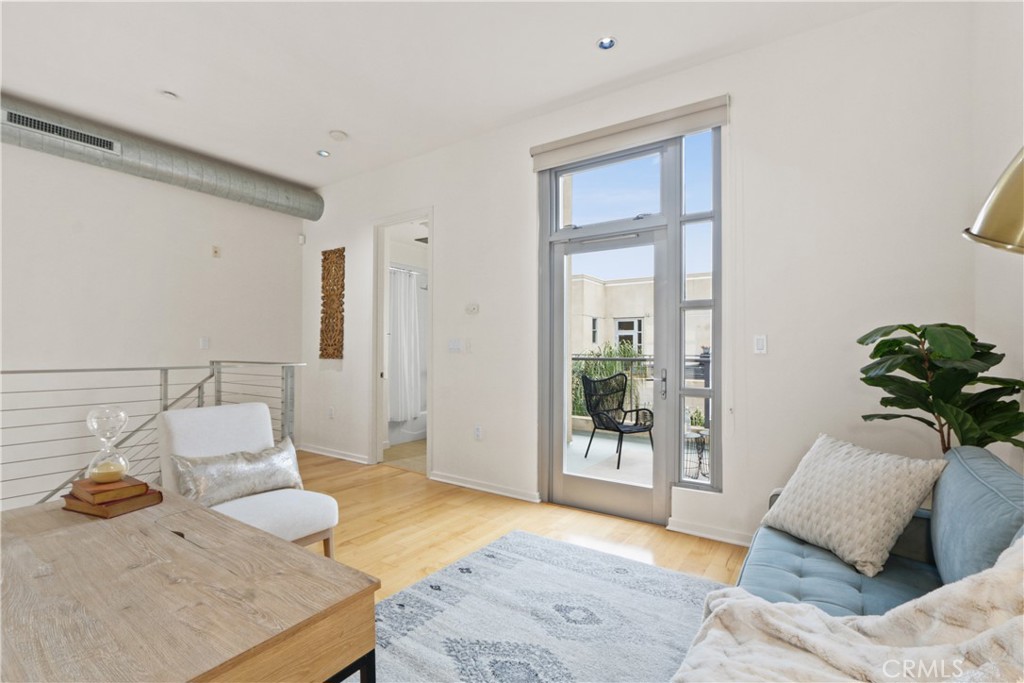 133 The Promenade North, Unit 402 Long Beach, CA 90802 - Photo 12 of 26 a living room with furniture and a window