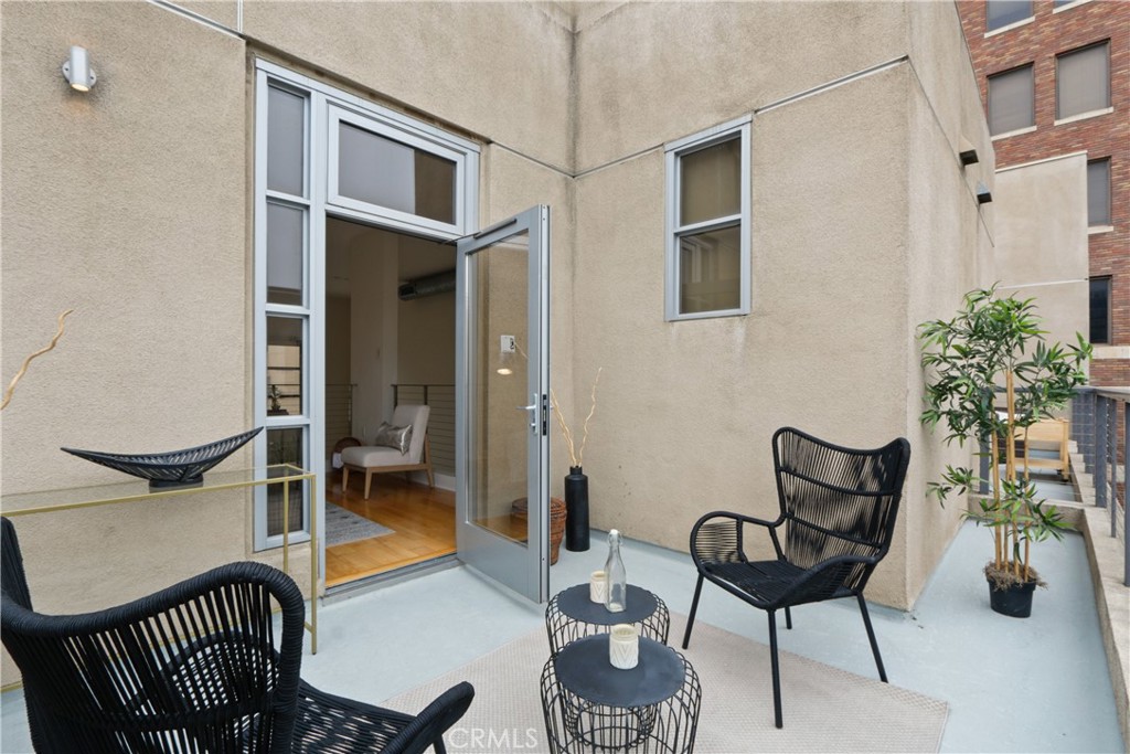 133 The Promenade North, Unit 402 Long Beach, CA 90802 - Photo 13 of 26 a outdoor space with a couch and chairs