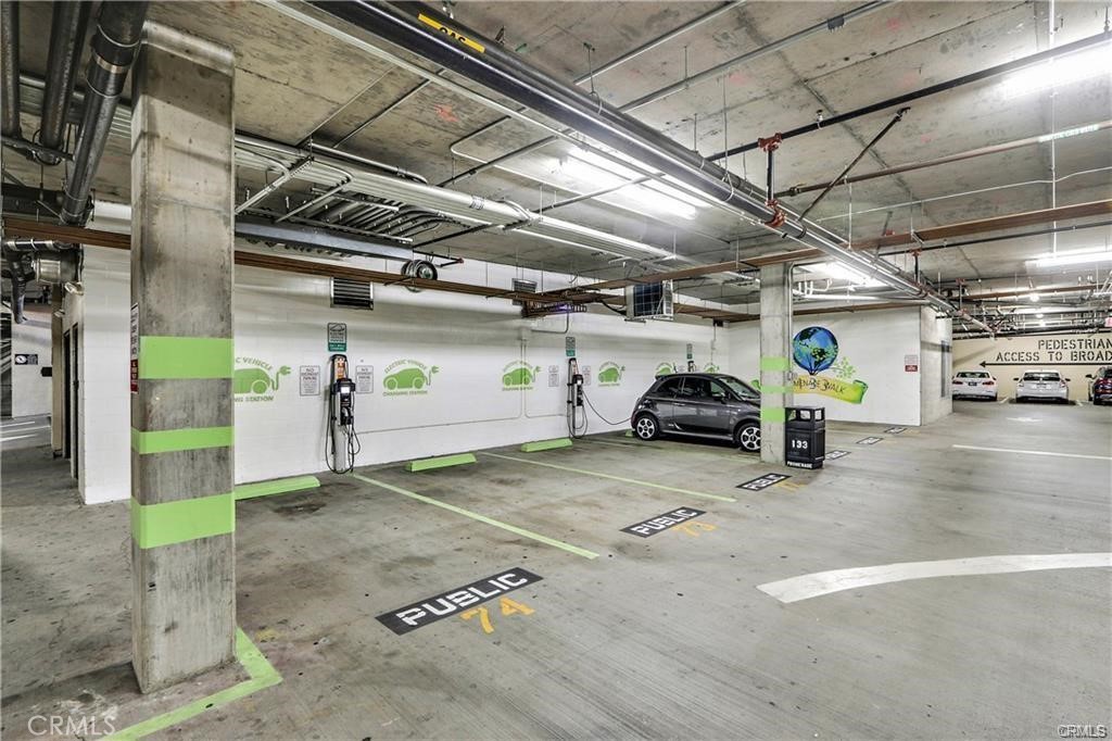 133 The Promenade North, Unit 402 Long Beach, CA 90802 - Photo 24 of 26 a view of parking garage with cars
