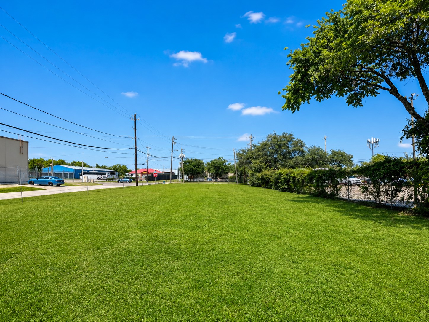 2002 Telephone Road Houston, TX 77023 - Photo 5 of 8 a view of a field of grass and trees