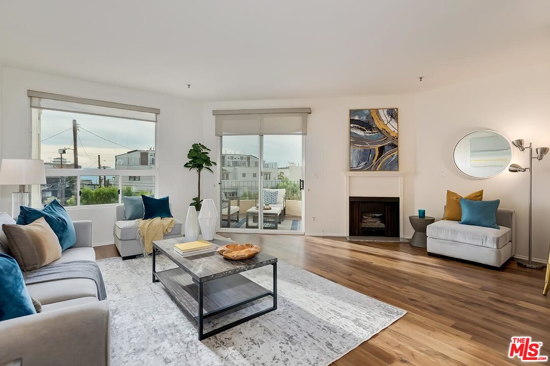 255 Main Street, Unit 207 Venice, CA 90291 - Photo 1 of 19 a living room with furniture and a fireplace