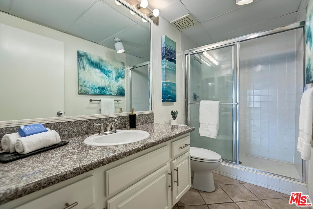 255 Main Street, Unit 207 Venice, CA 90291 - Photo 12 of 19 a bathroom with a granite countertop sink and a mirror
