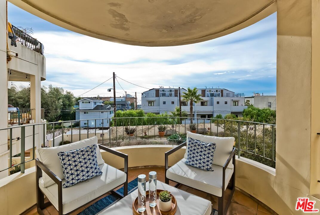 255 Main Street, Unit 207 Venice, CA 90291 - Photo 2 of 19 a view of a balcony with two chairs and a potted plant