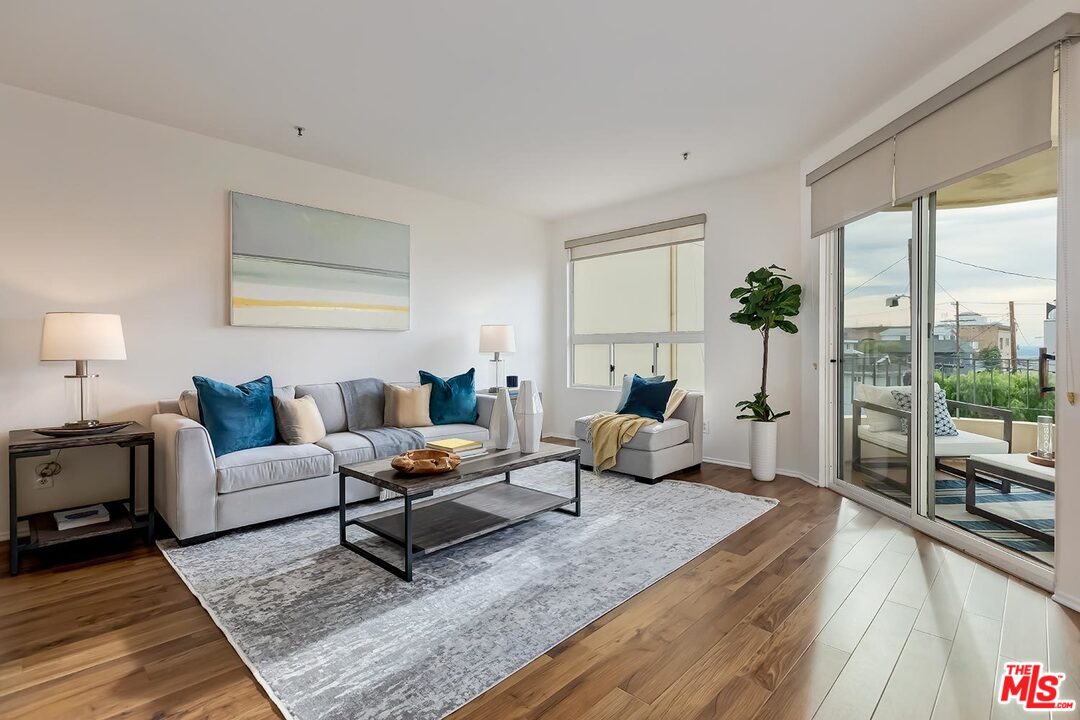 255 Main Street, Unit 207 Venice, CA 90291 - Photo 3 of 19 a living room with furniture or couch and a wooden floor