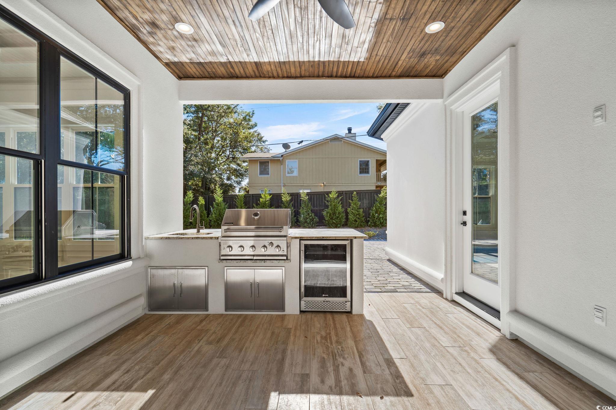 311 73rd Avenue North Myrtle Beach, SC 29572 - Photo 19 of 40 View of patio / terrace featuring exterior kitchen, ceiling fan, and beverage cooler