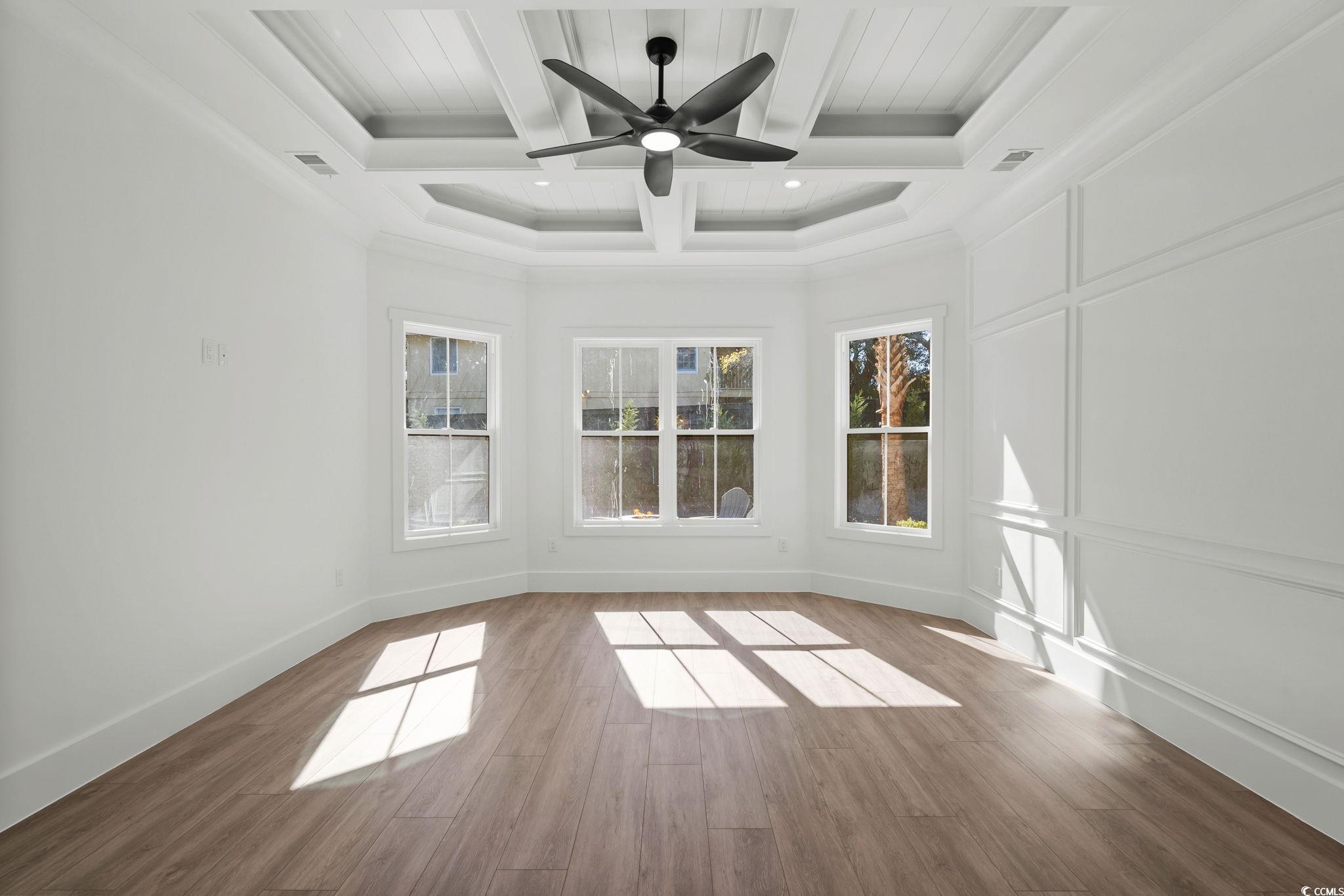311 73rd Avenue North Myrtle Beach, SC 29572 - Photo 21 of 40 Unfurnished sunroom featuring beamed ceiling and coffered ceiling