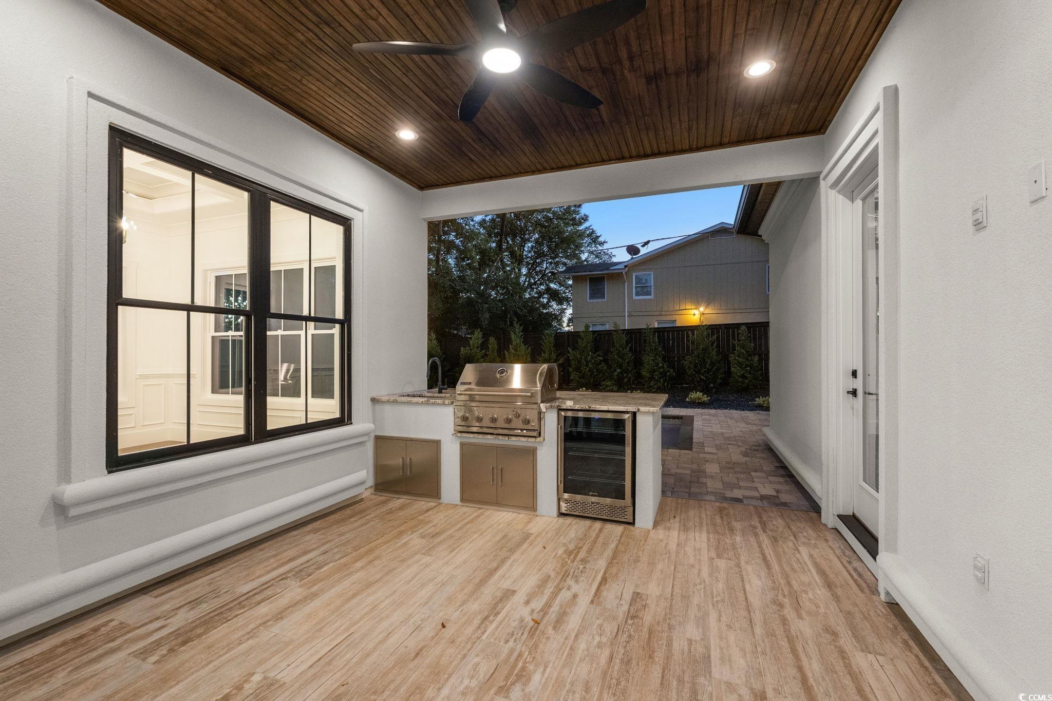 311 73rd Avenue North Myrtle Beach, SC 29572 - Photo 37 of 40 View of patio featuring an outdoor kitchen, wine cooler, and a ceiling fan