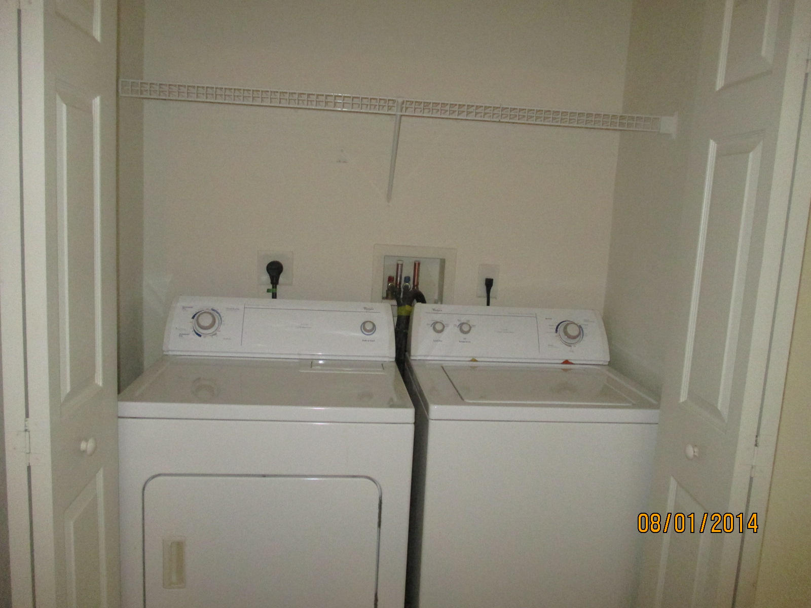 541 Southeast Prescott Place, Unit 541 Stuart, FL 34994 - Photo 11 of 20 a utility room with dryer and washer